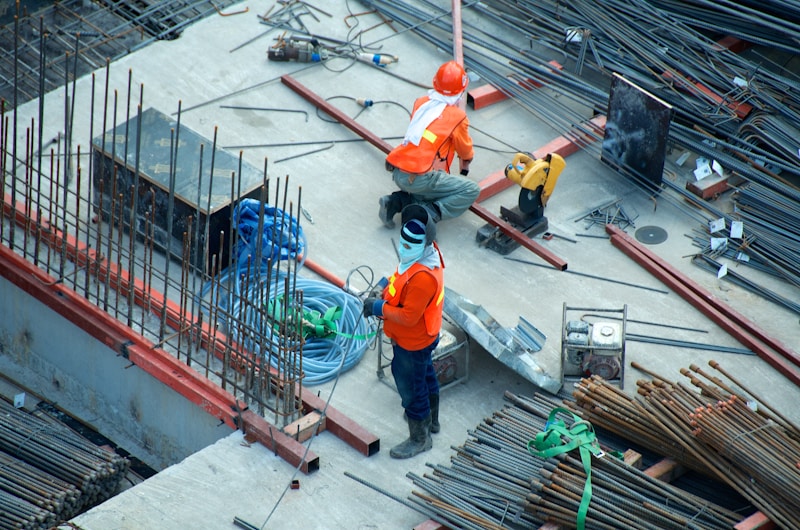 Construction professionals working on a building structure